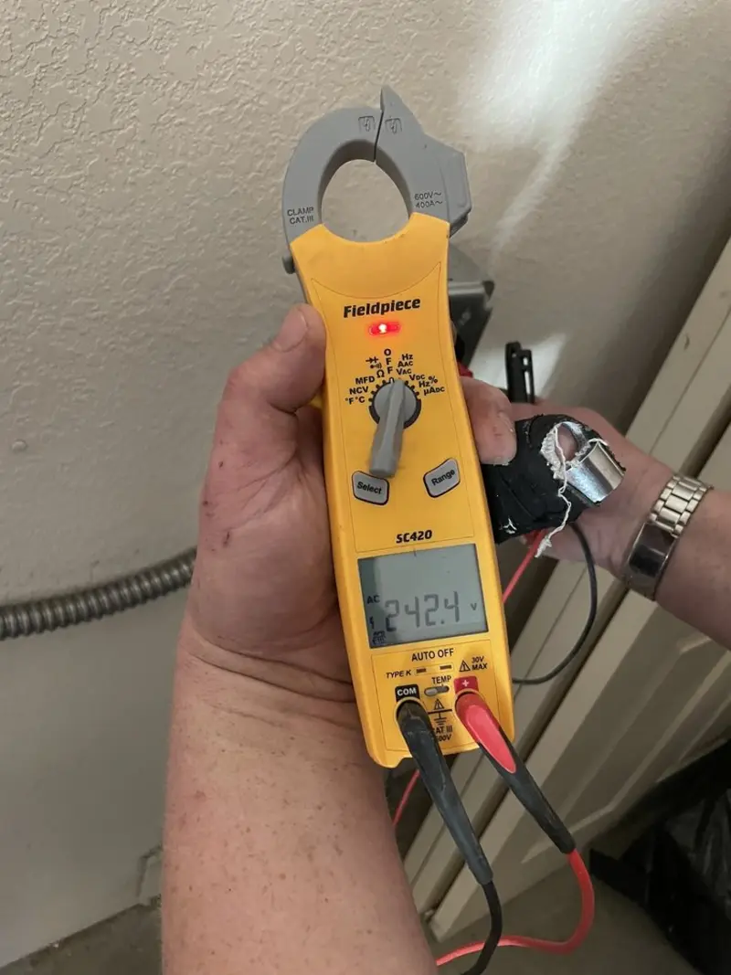 Voltage testing with clamp meter during Ceiling Fan Installation in Clearview